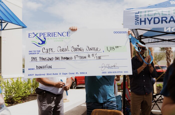 Donation check presented to the Cape Coral Caring Center