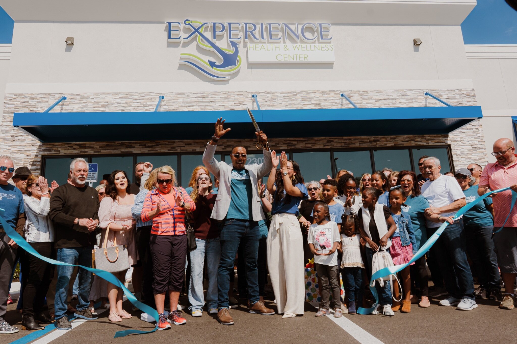 Dr. Omar Clark and the Experience Health & Wellness Center team and community at the Cape Coral ribbon cutting