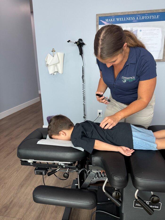 Gentle chiropractic care for a child at Experience Health & Wellness Center