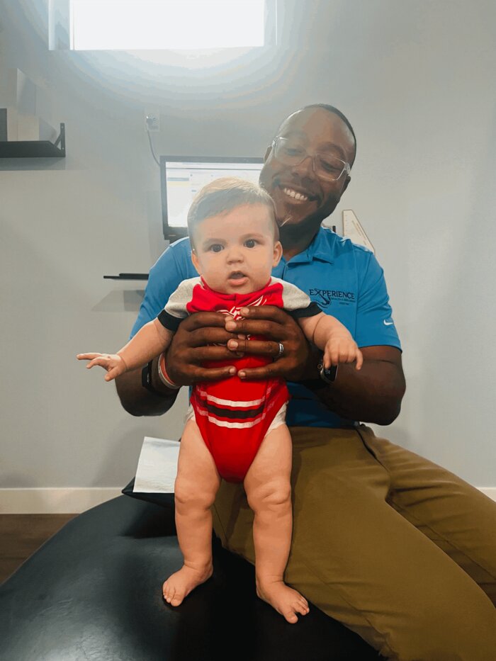 Gentle chiropractic care for a child at Experience Health & Wellness Center